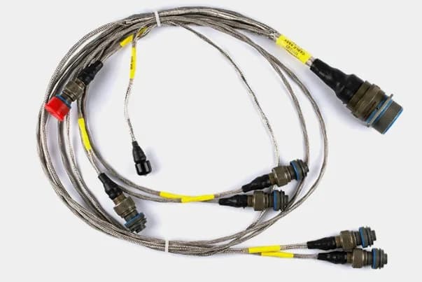 Shielded MIL-SPEC wire harness with braided screening, circular bayonet connectors, and identification sleeving